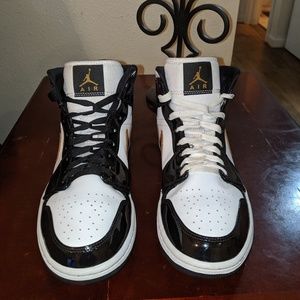 Jordan 1 mid black white and gold